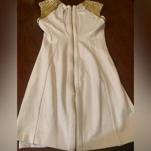 Absolutely gorgeous, like new rare white Bebe dress with golden studs. Size M